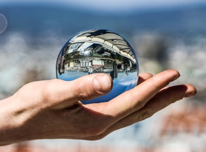 metallic reflective sphere on a hand