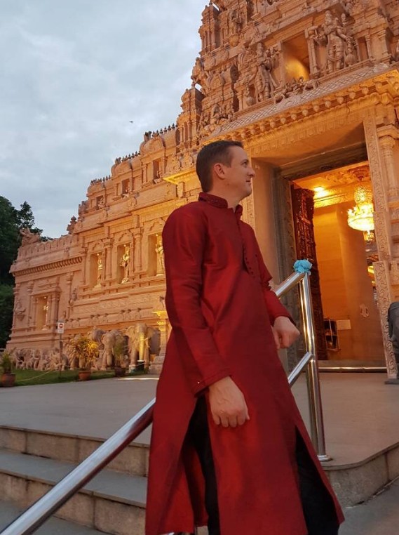 Matt in asia standing by a temple