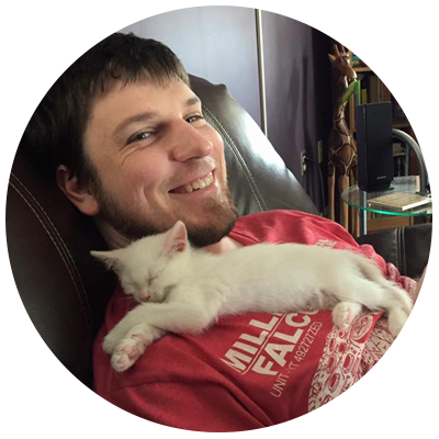 guy in a red shirt with a white cat on his chest